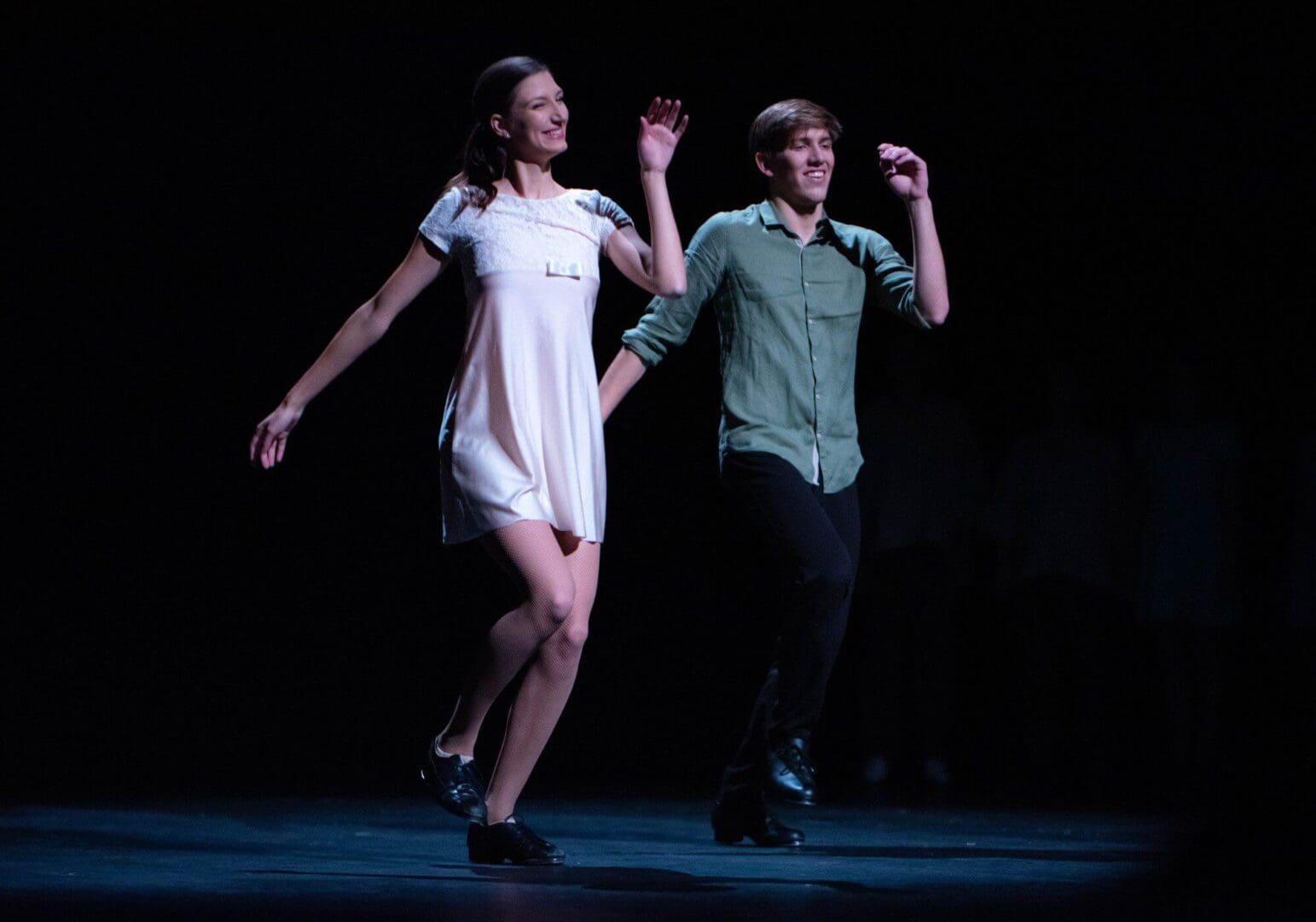 Dancers performing tap routine on stage