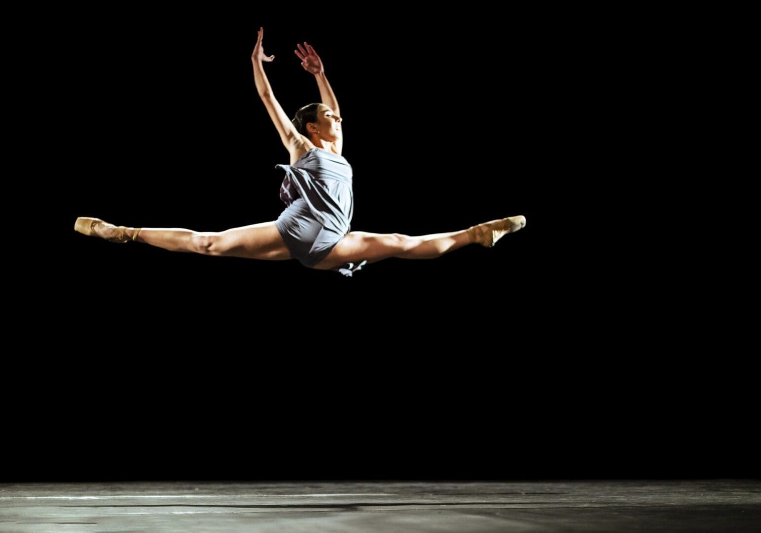 Ballet performance with dancer in mid-air