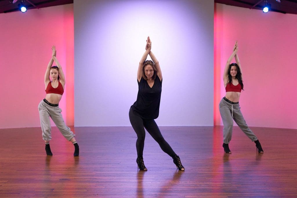 Three women dancing in a studio.